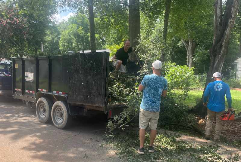 augusta junk removal loading a trailer with yard waste removal in Augusta Georgia